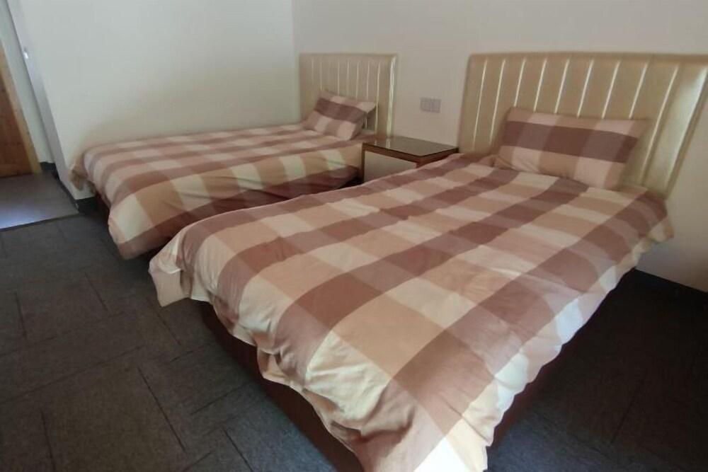 Zhouxixuanminsu Room