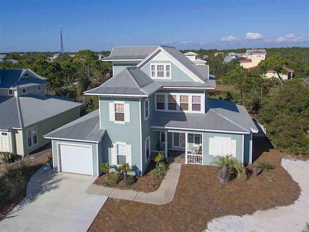 Coquille at Martinique Home features Golf Cart and Bikes to Use by RedAwning Aerial View